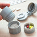 travel-friendly-pill-organiser-with-built-in-pill-crusher-ortoprime-uk